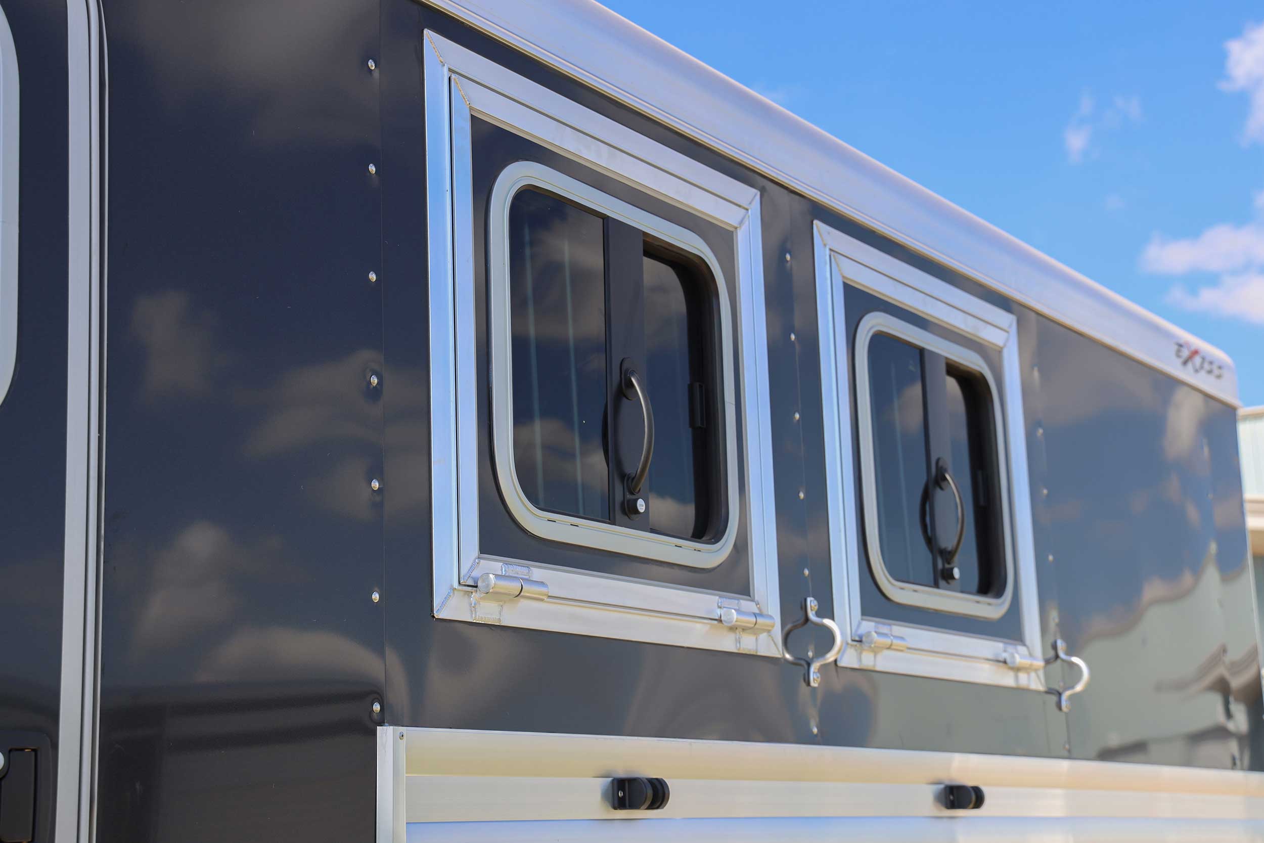 Horse trailers drop feed doors