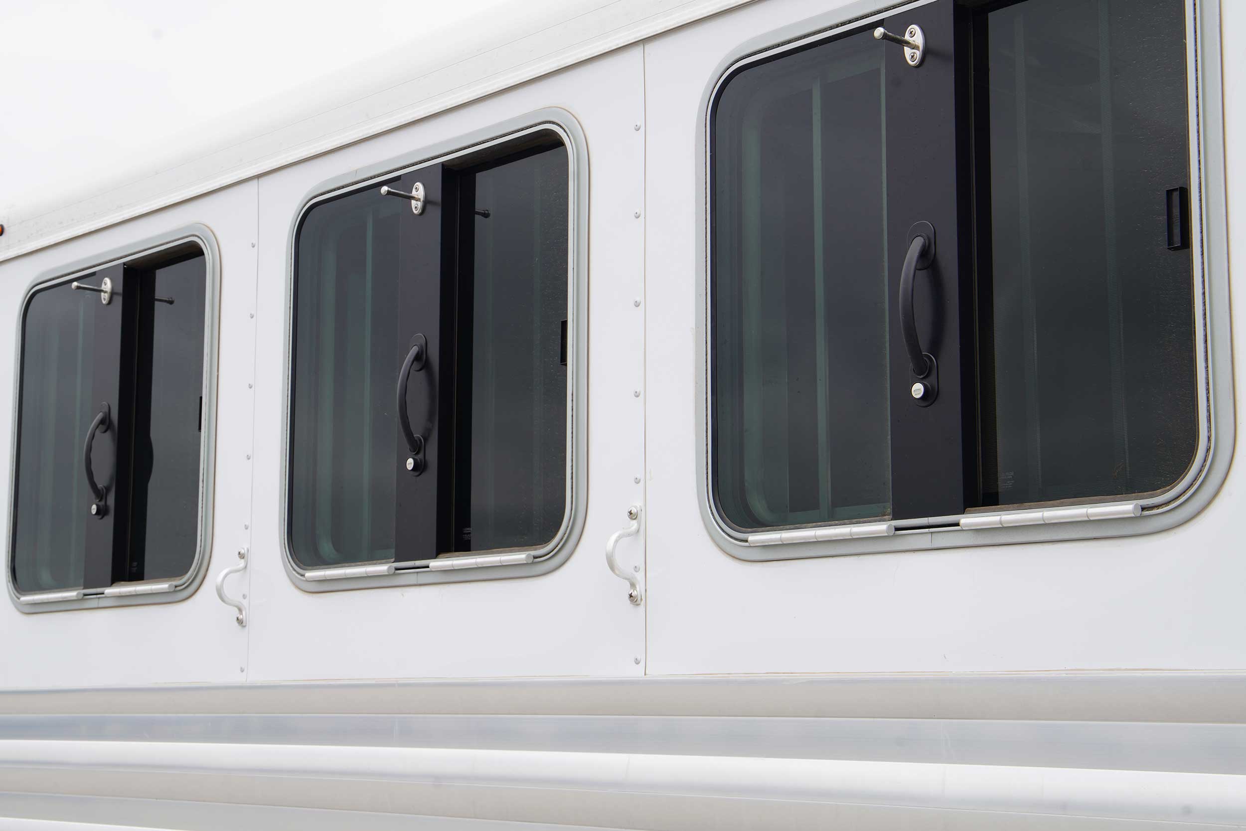 Drop feed windows on horse trailer